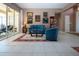 Bright living room with elegant decor, cozy seating, and sliding glass doors opening to the lanai at 1308 Crystal Greens Dr, Sun City Center, FL 33573