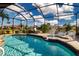 A beautiful screened-in pool with a fountain and chairs to relax and enjoy the beautiful clear sky at 1308 Crystal Greens Dr, Sun City Center, FL 33573