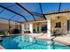 Outdoor screened-in pool with adjacent patio and outdoor dining area under ceiling fans at 1308 Crystal Greens Dr, Sun City Center, FL 33573