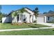 Charming single-story home featuring fresh landscaping, a well-manicured lawn, and a neutral-toned exterior at 13355 Willow Bluestar Loop, Riverview, FL 33579