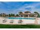 Community swimming pool featuring lounge chairs, and a covered patio area at 13355 Willow Bluestar Loop, Riverview, FL 33579