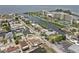 Panoramic aerial shot of waterfront homes with canal access, condos, and scenic views of the water at 13701 Garris Dr, Hudson, FL 34667