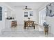 Bright dining area featuring tiled floors, ceiling fan, and plenty of natural light at 13701 Garris Dr, Hudson, FL 34667