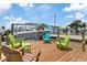 Private boat dock with boat lift and seating area, perfect for waterfront living at 13701 Garris Dr, Hudson, FL 34667
