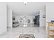 Spacious living room with large format marble flooring and modern decor at 13701 Garris Dr, Hudson, FL 34667