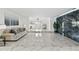 Spacious living room featuring high-gloss marble flooring and modern decor at 13701 Garris Dr, Hudson, FL 34667