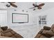 Entertainment room featuring a large screen and luxurious seating at 13701 Garris Dr, Hudson, FL 34667