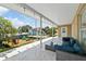Cozy covered patio with water views, outdoor seating, and string lights at 13701 Garris Dr, Hudson, FL 34667