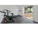 Shed interior containing workout equipment with outdoor view and stone path access at 13701 Garris Dr, Hudson, FL 34667
