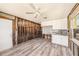 Bright kitchen with white cabinets, new flooring, and ample natural light at 14040 Miramar Ave, Madeira Beach, FL 33708