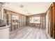 Cozy living room with new flooring, ceiling fan, and bright natural light at 14040 Miramar Ave, Madeira Beach, FL 33708