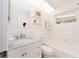 Clean, white bathroom with modern vanity, shower/tub, and a bright skylight at 14173 90Th Ave, Seminole, FL 33776