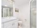 Clean and bright bathroom with light blue vanity, offering a refreshing look at 14173 90Th Ave, Seminole, FL 33776