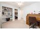 Bedroom featuring a storage unit and a wood desk area, offering functionality at 14173 90Th Ave, Seminole, FL 33776