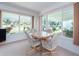 Dining room with large picture windows allowing ample sunlight and views to landscaping at 14173 90Th Ave, Seminole, FL 33776