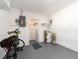 Clean garage area with extra storage, laundry hookups and neutral painted floors at 14173 90Th Ave, Seminole, FL 33776