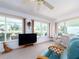 Lanai with ceiling fan, neutral carpet, and views of the community landscaping at 14173 90Th Ave, Seminole, FL 33776
