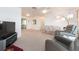 Open living room area with neutral carpet and a view into adjacent dining and kitchen spaces at 14173 90Th Ave, Seminole, FL 33776
