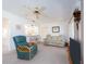 Bright living room with bar pass through to kitchen, ceiling fan and large windows at 14173 90Th Ave, Seminole, FL 33776