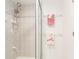 Walk-in shower tiled, featuring modern fixtures and providing a refreshing experience at 14173 90Th Ave, Seminole, FL 33776