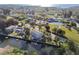 Aerial view of a neighborhood with homes on the water and a clear blue sky at 14924 Old Dixie Hwy, Hudson, FL 34667