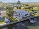 Aerial view of waterfront property with deck, dock, and canal access at 14924 Old Dixie Hwy, Hudson, FL 34667