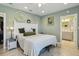 Cozy bedroom featuring a white wood bed frame and an en-suite bathroom at 14924 Old Dixie Hwy, Hudson, FL 34667