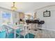 Bright dining area with modern table and chairs, situated near the kitchen and breakfast bar at 14924 Old Dixie Hwy, Hudson, FL 34667