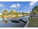 Scenic waterfront view with a private dock and a boat ready for aquatic adventures at 14924 Old Dixie Hwy, Hudson, FL 34667