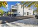 Two-story home featuring siding, a second story deck, and an asphalt and stone driveway at 14924 Old Dixie Hwy, Hudson, FL 34667