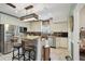 Contemporary kitchen with stainless steel appliances, granite countertops, and bar stool seating at 14924 Old Dixie Hwy, Hudson, FL 34667
