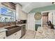 Updated kitchen featuring stainless steel appliances, stylish backsplash, and granite countertops at 14924 Old Dixie Hwy, Hudson, FL 34667
