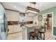 Modern kitchen with stainless steel appliances, granite countertops, and island seating at 14924 Old Dixie Hwy, Hudson, FL 34667
