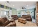 Comfortable living room with stylish furnishings and open access to other rooms at 14924 Old Dixie Hwy, Hudson, FL 34667