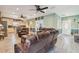 Open-concept living room with ample seating and a view into the updated kitchen at 14924 Old Dixie Hwy, Hudson, FL 34667