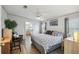 Spacious main bedroom featuring a private bathroom, comfortable seating area, and natural lighting at 14924 Old Dixie Hwy, Hudson, FL 34667