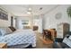 Bright main bedroom featuring warm accents, hardwood flooring, and bonus seating area at 14924 Old Dixie Hwy, Hudson, FL 34667
