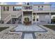 Backyard patio with sleek pavers, leading to outdoor seating and entertainment area by the water at 14924 Old Dixie Hwy, Hudson, FL 34667