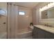 Bathroom features a tub with white subway tile, marble countertop, and hexagon tile flooring at 1510 49Th N St, St Petersburg, FL 33710