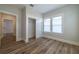 Bedroom featuring wood floors, a sliding door closet, and a window with plenty of natural light at 1510 49Th N St, St Petersburg, FL 33710