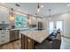 Bright, updated kitchen features stainless appliances, a breakfast bar, and elegant pendant lighting at 1510 49Th N St, St Petersburg, FL 33710