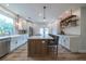 Well-lit kitchen boasts stainless steel appliances, a breakfast bar island, and ample cabinet space at 1510 49Th N St, St Petersburg, FL 33710