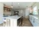 Spacious open kitchen with stainless steel appliances, island, and modern white cabinetry at 1510 49Th N St, St Petersburg, FL 33710