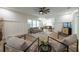 Bright living room with elegant furnishings, modern ceiling fan, and seamless flow to kitchen and dining at 1510 49Th N St, St Petersburg, FL 33710