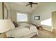 Comfortable main bedroom featuring a neutral color palette and complemented by wood floors and a ceiling fan at 1510 49Th N St, St Petersburg, FL 33710