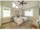 Bright main bedroom features a vaulted ceiling, large windows, and neutral decor at 1510 49Th N St, St Petersburg, FL 33710