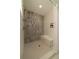 Modern shower featuring gray tiled walls, a built-in bench, and dual shower heads at 1510 49Th N St, St Petersburg, FL 33710