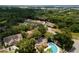 Aerial view of community featuring lush landscaping, pool, and well-maintained townhomes at 1701 Brigadoon Dr, Clearwater, FL 33759