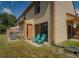 Cozy back patio with comfortable seating and a sliding glass door for easy indoor-outdoor living at 1701 Brigadoon Dr, Clearwater, FL 33759