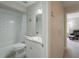 Bathroom with white subway tile shower/tub combination at 1701 Brigadoon Dr, Clearwater, FL 33759